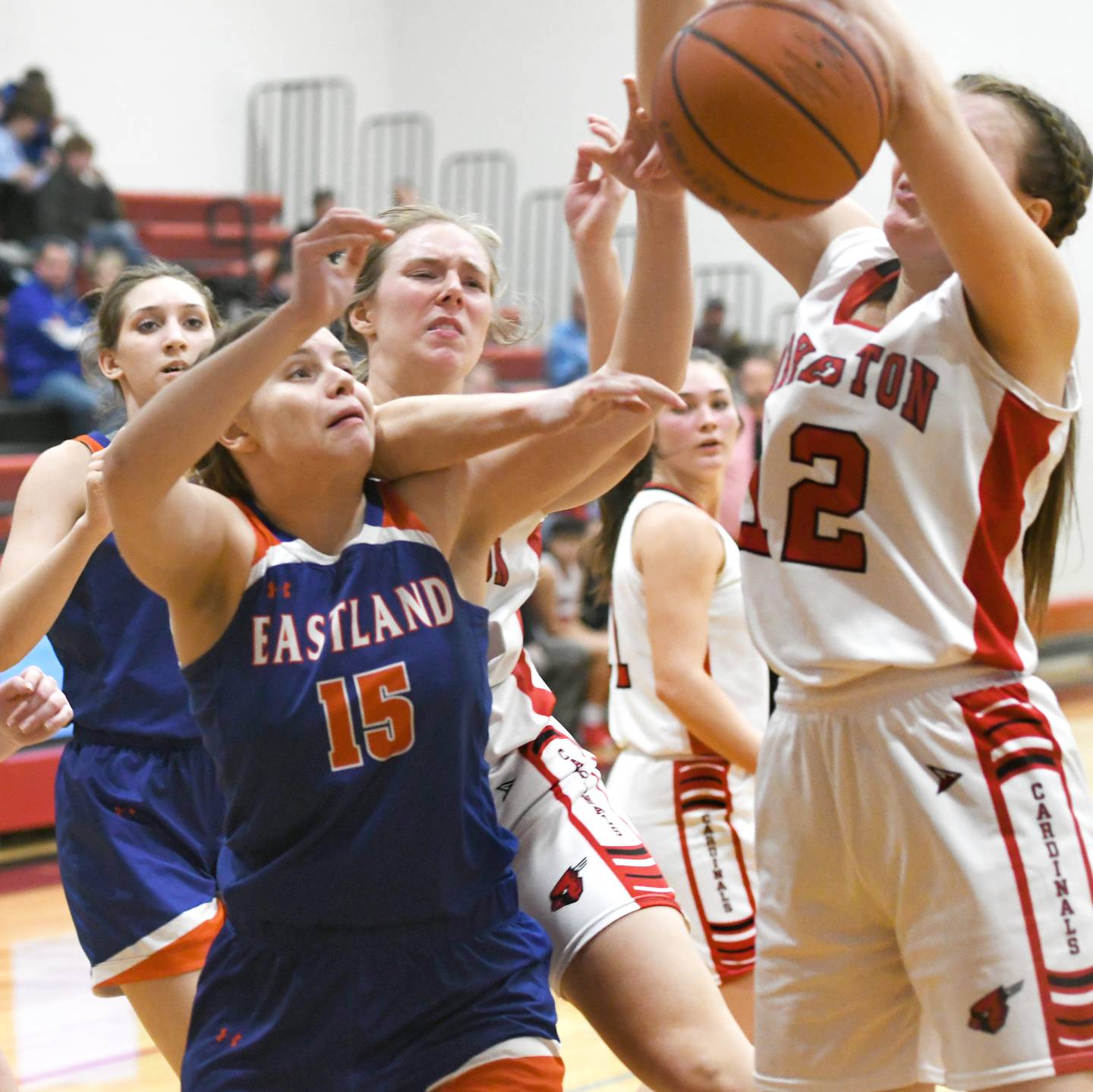 Eastland's Sarah Kempel (15) and Forreston's Hailey Greenfield (12) battle for a rebound during a NUIC game on Friday, Feb. 3 in Forreston.