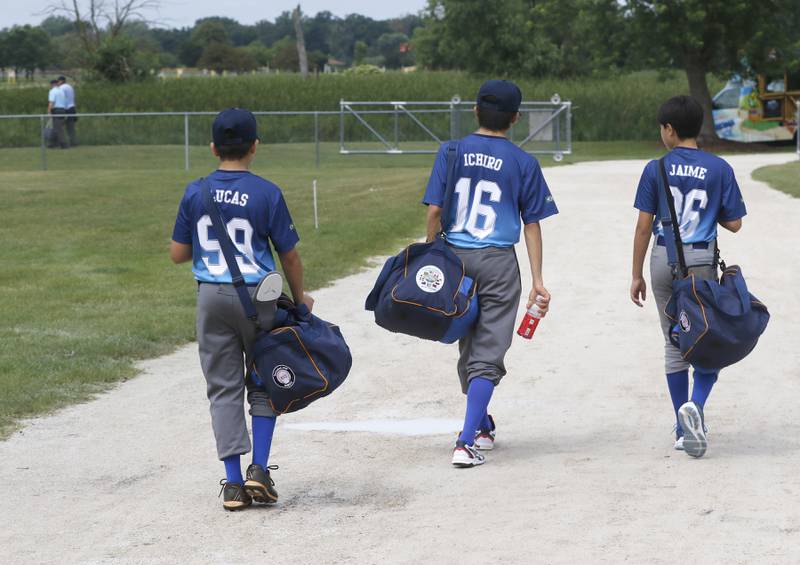 Members of the Beisebol baseball team from Brazil leave the park after their game in the Under 13 McHenry County Youth Sports Association’s Summer International Championship baseball tournament on Friday, July 11, 2025, at the Mickey Sund Baseball Complex in Crystal Lake's Lippold Park.