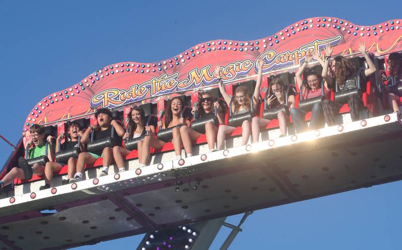 Kids react as they ride the Magic Carpet carnival ride during the Summer Fun Fest on Friday, June 14, 2024 in Ogelsby,.