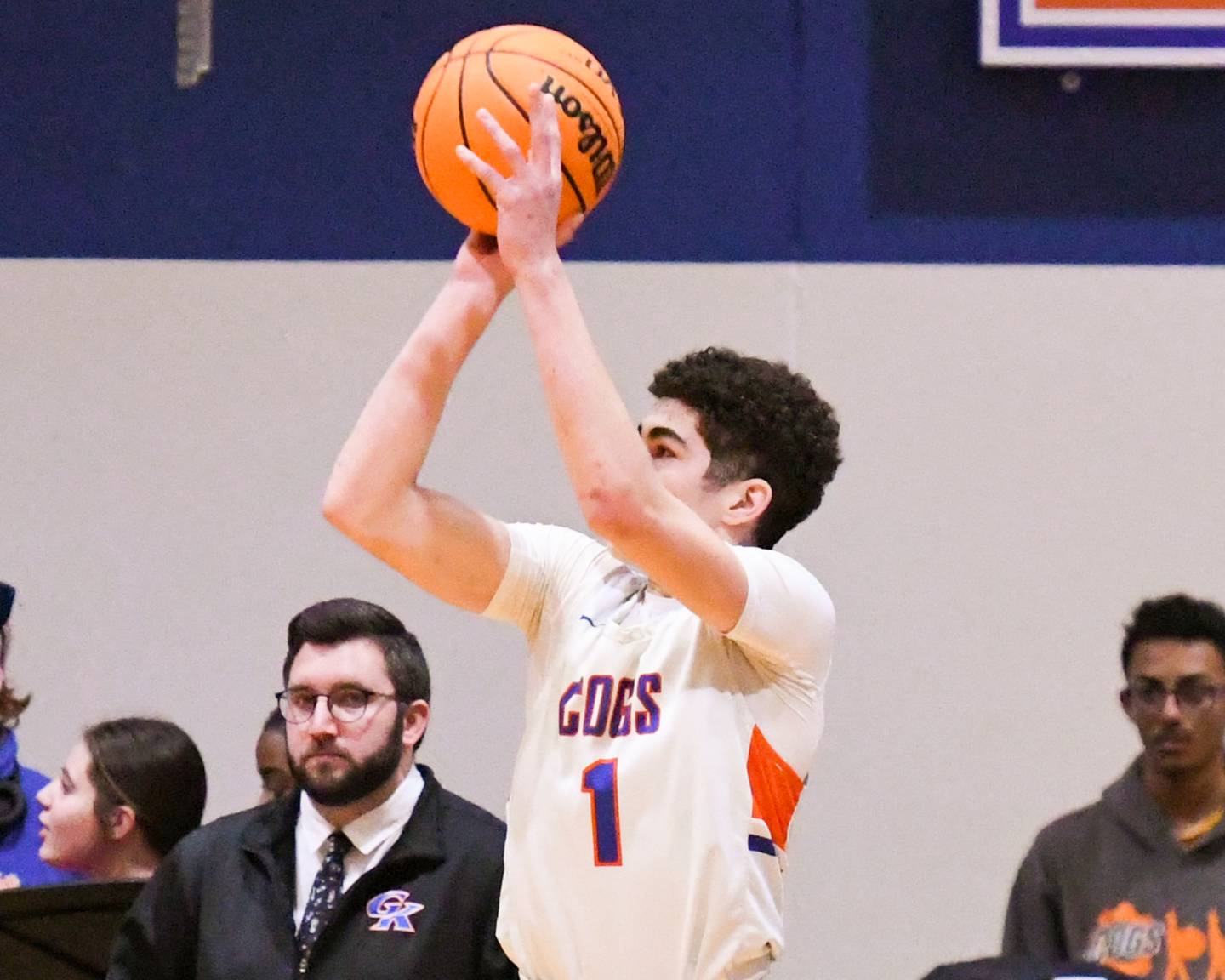 Genoa-Kingston's Marcus Johnson (1) makes a three-point shot during the game on Thursday Feb. 13, 2025, while taking on Harvard High School at Genoa-Kingston High School.