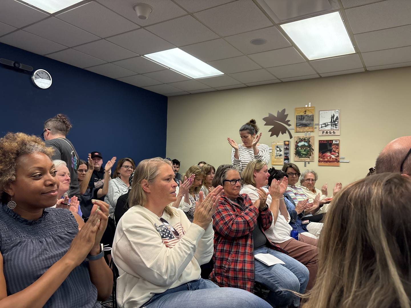 Crystal Lake residents clap following public comment during a park district board meeting June 5, 2025.