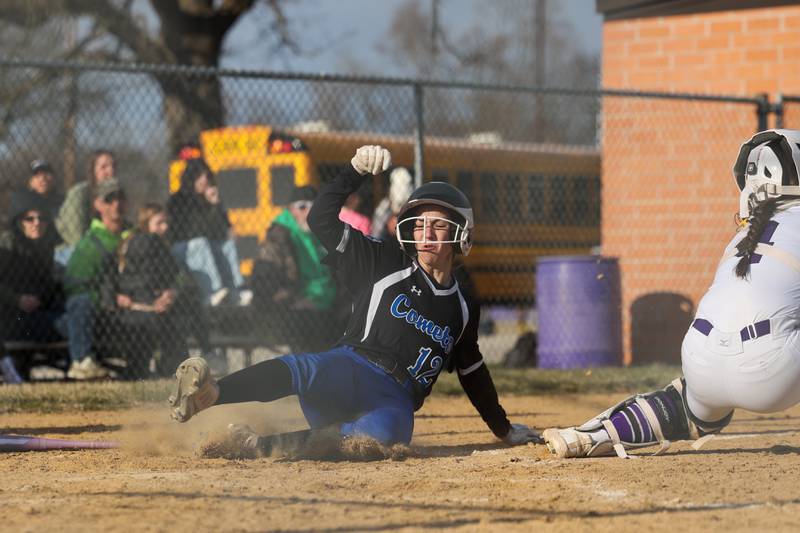 Central's Mia Archer slides in behind Wilmington's Madisyn Rossow during the Wildcats' 22-5 victory over Central on Wednesday, March 26, 2025.