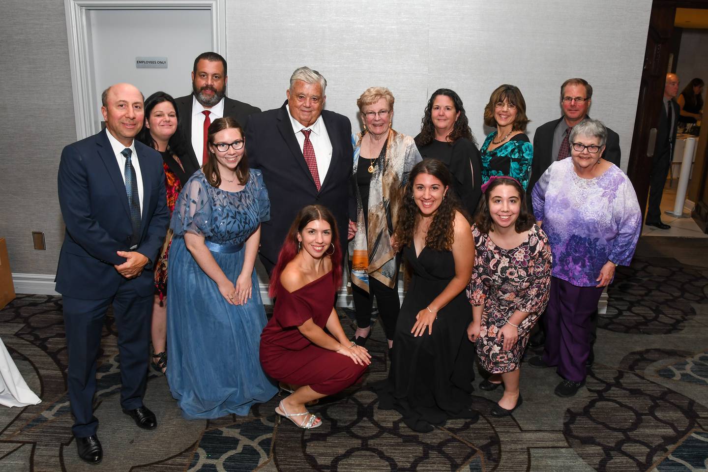 Trinity Services in New Lenox honored current board chairman Raymond D. McShane for 50 years of service at its 33rd annual “Better Together” dinner dance on Saturday, Sept. 24, 2022, at The Odyssey in Tinley Park. Pictured are members of McShane's family. They are (from left, standing): Tony Vari, Kadie McShane, Ray McShane, Jr., Raymond D. McShane, Lynda McShane, Cathey Koerner, Sue Vari and Craig Koerner, and (from left, crouching): : Emily Mepham, Lauren Vari, Sarah Vari, Christin Vari and Irene Huffman.