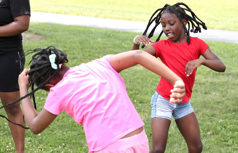 A dance party breaks out during a break at Camp Power Tuesday, July 18, 2023, at Welsh Park in DeKalb. Camp Power, which is run by the Kishwaukee Valley YMCA, is a summer program for youth at University Village that provides positive activities for kids.