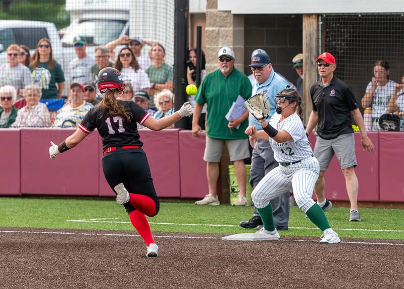 St. Bede's Ava Balestri awaits the throw to third as Brimfield's Layla Hersemann slides in with a triple in the sixth inning of Friday's Class 2A Chillicothe Sectional championship. Brimfield scored four runs in the bottom of the sixth inning to rally for a 4-1 win.