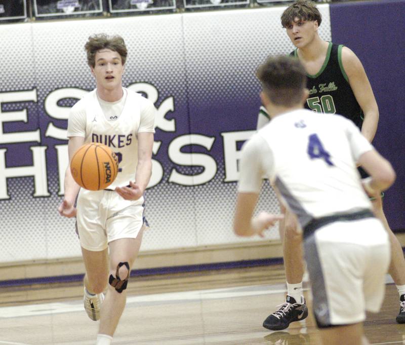 Dixon's Gabe Rowley gets a pass from teammate Brody Nicklaus. Dixon hosted Rock Falls in boys basketball Friday, February 14, 2025 at Lancaster Gym at Dixon High School. Rock Falls won a hard fought game 48-46.