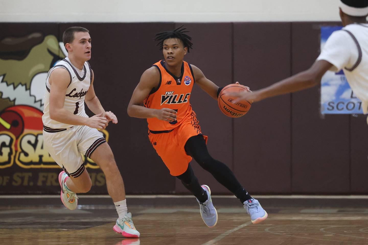 Romeoville’s EJ Mosley Jr. works the ball upcourt against Lockport in the 2023 WJOL Thanksgiving Tournament on Monday, Nov. 20, 2023, in Joliet.