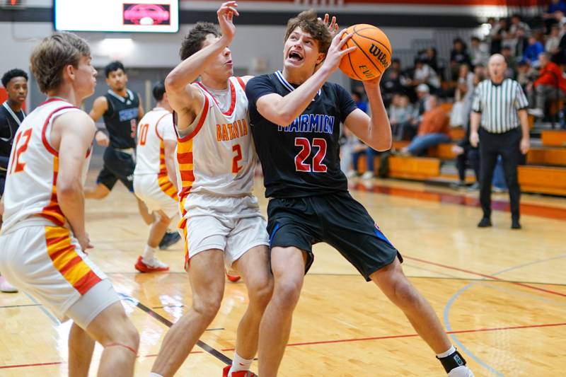 Marmion’s Colin McEniry (22) posts up against Batavia's Olan Johnson (2) during a game at Batavia High School on Wednesday, Nov. 26, 2025.