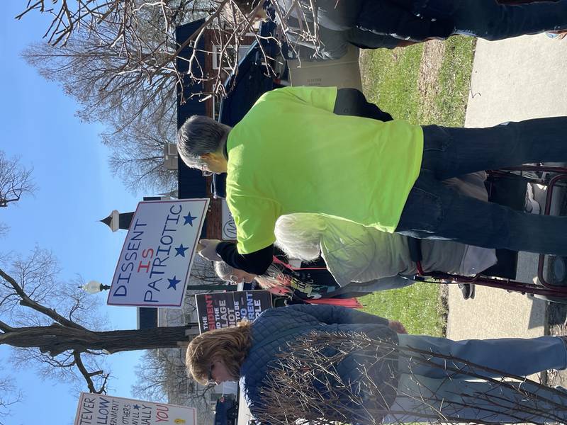 Protesters held signs as they lined up along 9th Street at City Square in downtown Lockport for a No Kings rally in opposition to the Trump administration on Saturday, March 28, 2026.