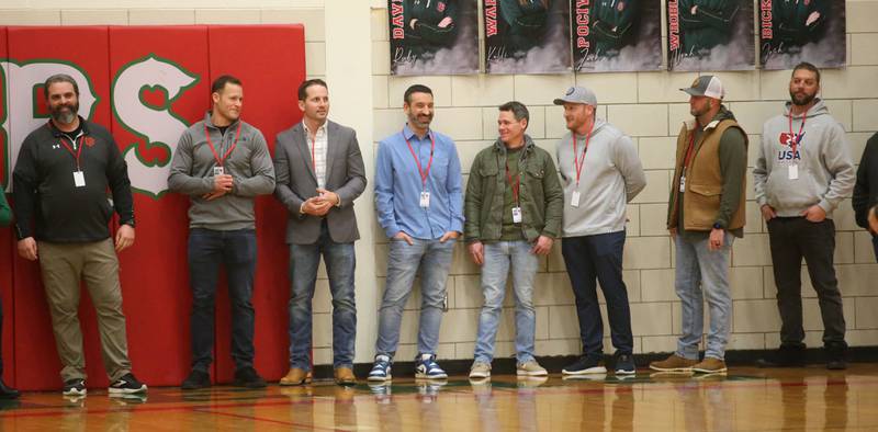 Members of the L-P 1999-2000 boys wrestling team is introduced at halftime during the La Salle-Peru Township High School Hall of Honor ceremony on Friday, Feb. 7, 2025 in Sellett Gymnasium at L-P High School. Korsan was the head athletic trainer at L-P.