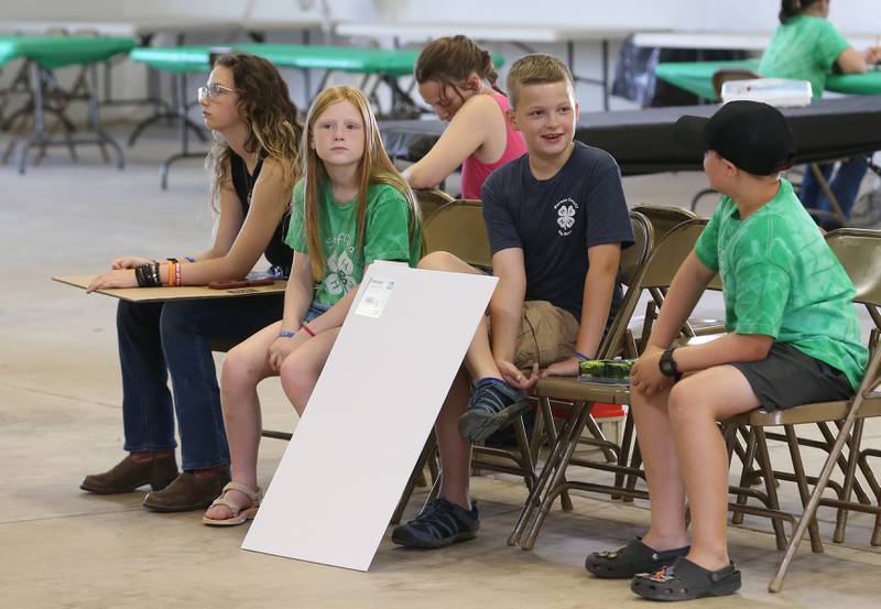 Kids wait to have their projects judged during the Bureau County 4-H Fair on Thursday, July 10, 2025 at the Bureau County Fairgrounds in Princeton.
