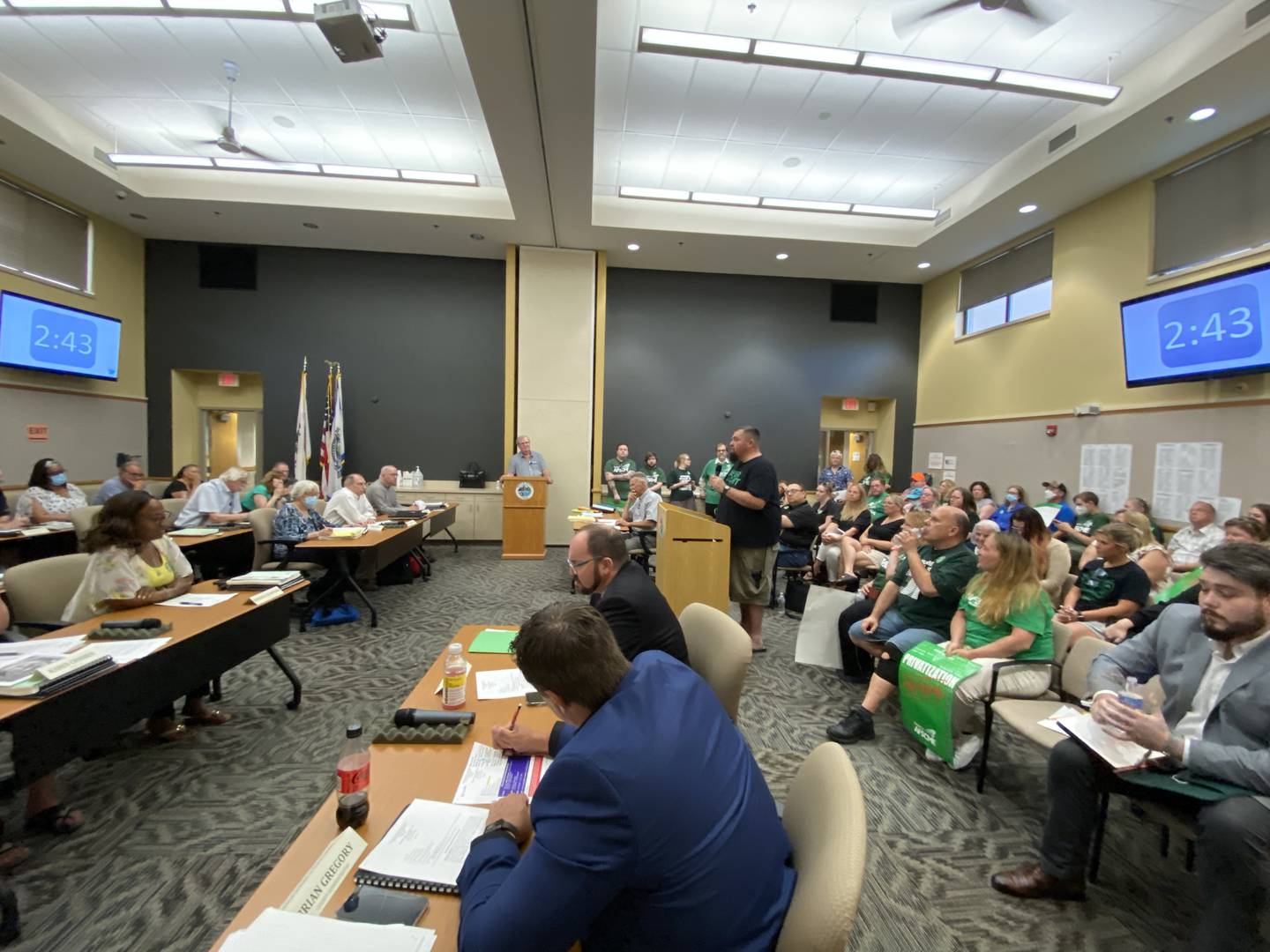 Chuck Coulter (middle), a maintenance worker at the DeKalb County Rehab and Nursing Center and union president of American Federation of State, County and Municipal Employees #3537, speaks to the DeKalb County Board Wednesday, June 15, 2022 imploring the board to vote no on a proposed sale of the struggling DeKalb County Rehabilitation and Nursing Center. Coulter was joined by nearly two dozen fellow union members standing in opposition to selling the center to a private management company.