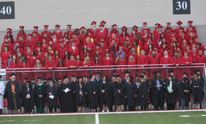 La Salle-Peru Township High School graduates and staff stand during the L-P Class of 2026 commencement ceremony on Thursday, May 14, 2026 at Howard Fellows Stadium.