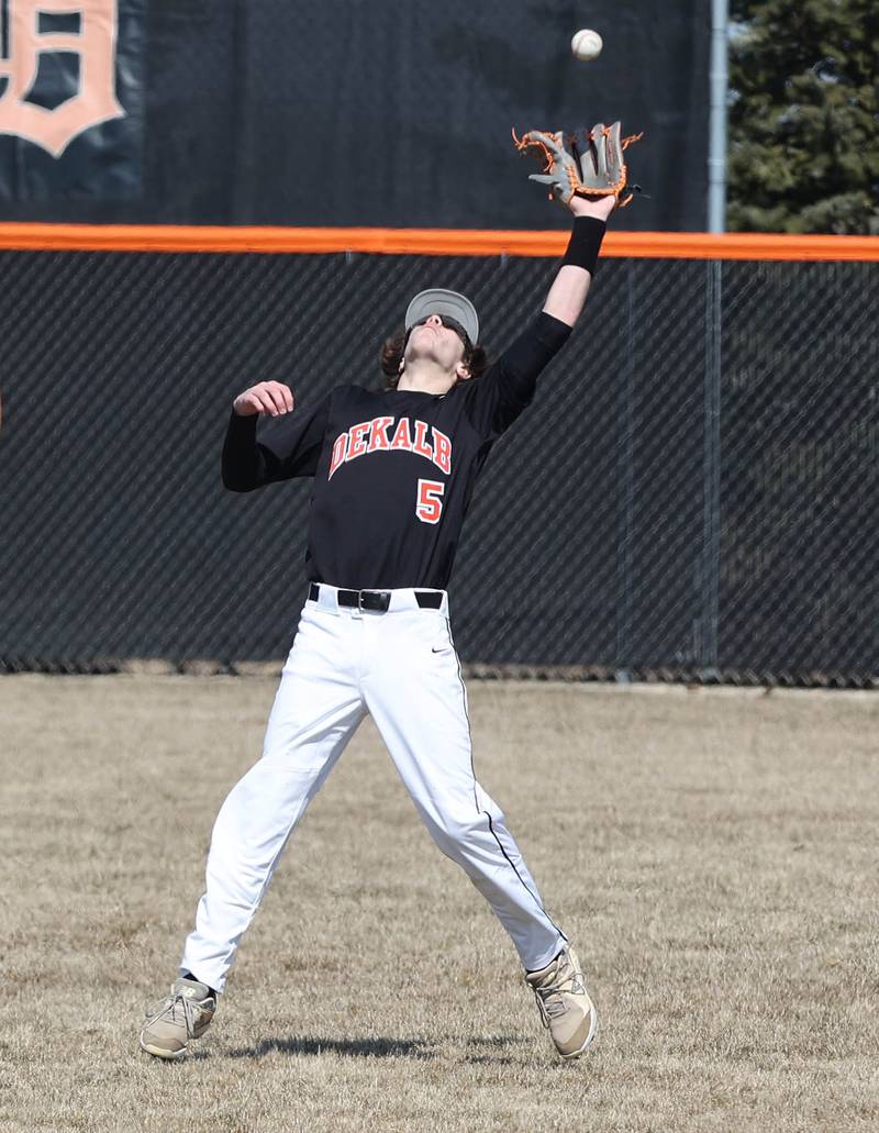 DeKalb’s Cole Latimer hauls in a fly ball during their game against Dixon Tuesday, March 28, 2023, at DeKalb High School.