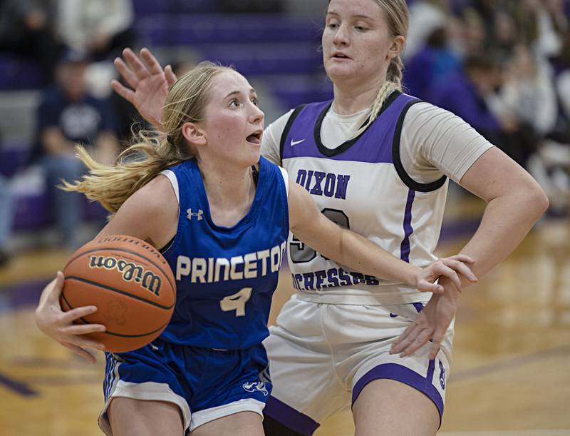 Princeton’s Paige Jesse handles the ball against Dixon’s Jessie Pitman Thursday, Jan. 4, 2024 at Dixon High School.