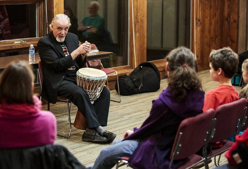 Participants watch while Jim May of Spring Grove tells a story Nov. 23, 2013, during the sixth annual Tellebration Celebration hosted by the McHenry County Conservation District and the McHenry County Storytelling Guild. The Tellebration Celebration is an event where  storytellers and community members tell stories appropriate for all ages about nature, folklore and tall tales at the Prairieview Education Center in Crystal Lake.