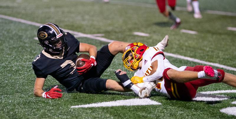 Batavia’s Gerke Drew (11) tackles Glenbard North's Robertson Johnnie (3) after the catch during a football game at Glenbard North High School in Carol Stream on Friday, Sep 23, 2022.