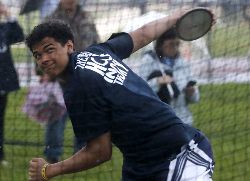 Cary-Grove’s Reece Ihenacho throws the discus Friday, May 12, 2023, during the Fox Valley Conference Boys Track and Field Meet at Huntley High School.