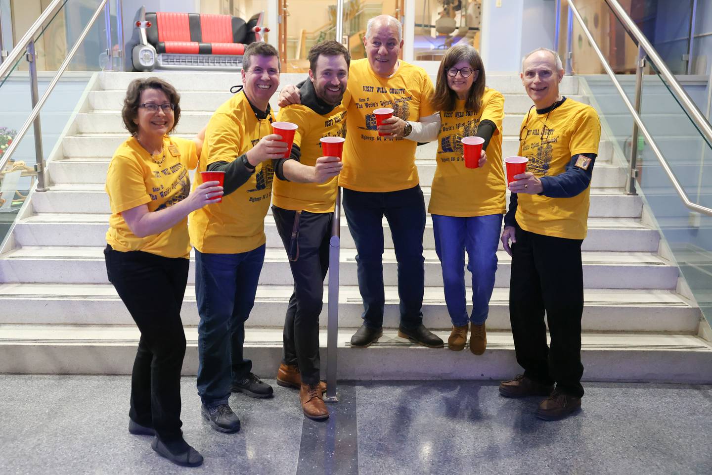 Volunteers pose for a photo during a kegger fundraiser to save the old Will County Courthouse at the Joliet Area Historical Museum on Friday, February 3rd.