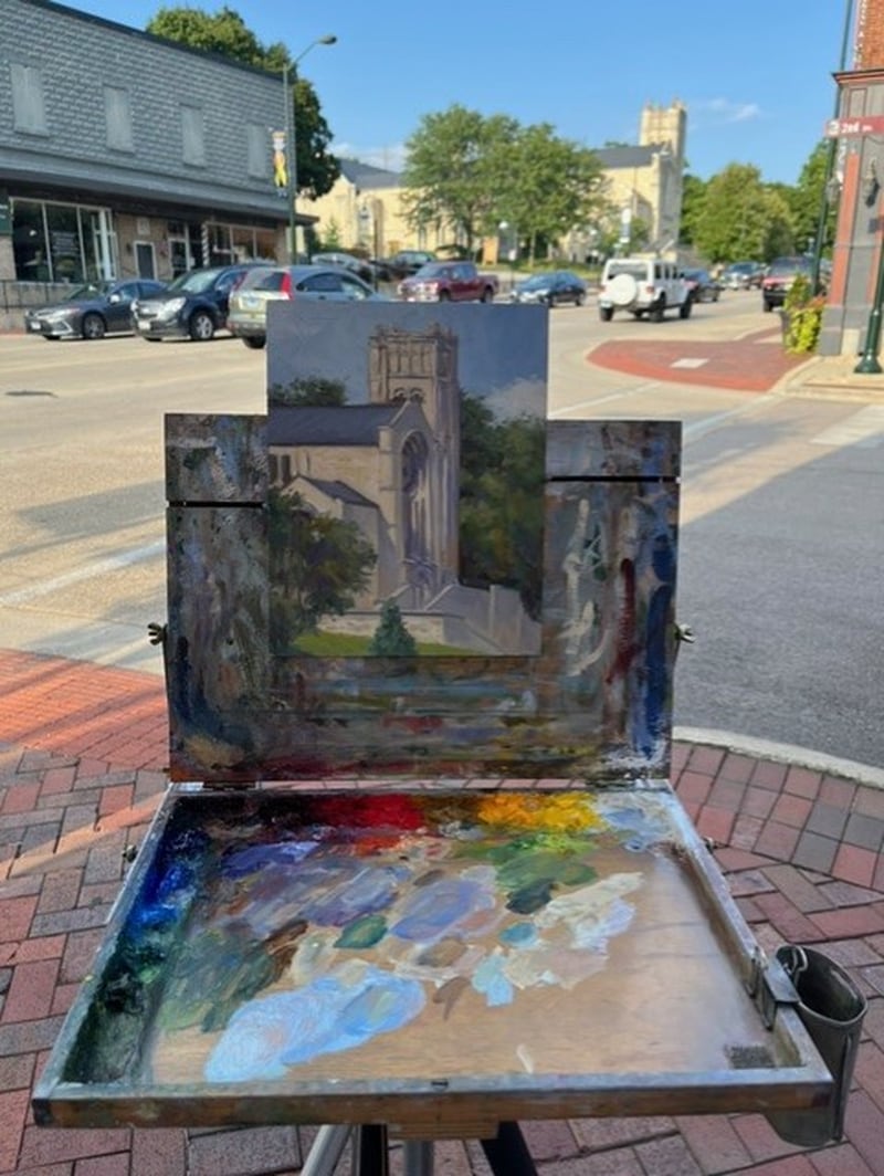 Chicago artist Don Yang paints the Baker Memorial United Methodist Church in downtown St. Charles during the Plein Air event in 2024.