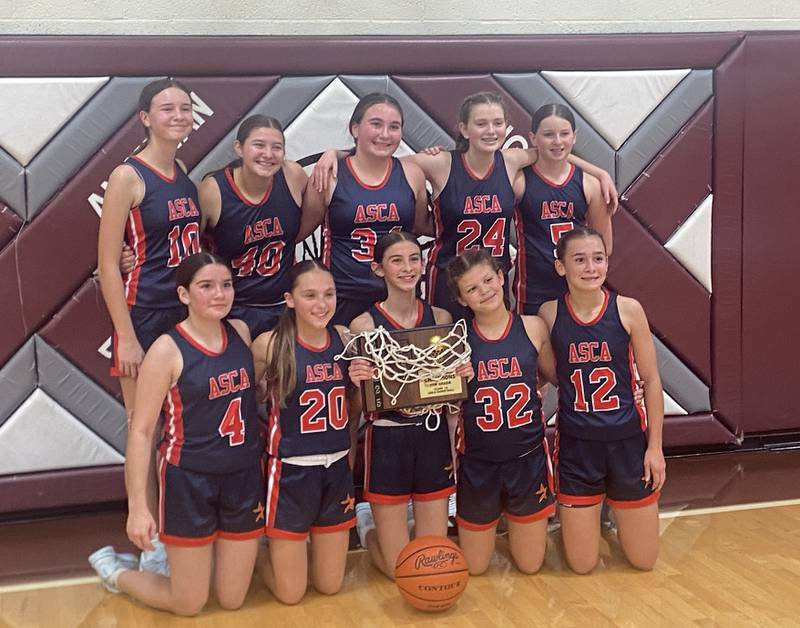 The Carlo Acutis girls basketball team beat Annawan 44-13 on Tuesday to win the IESA Class 1A Annawan Regional championship. Carlo Acutis will play in the sectional on Dec. 3 in LaHarpe. Pictured, back row (left to right) are Sophia Morrow, Callie Hanson, Sierra Biagioni, Evey Gedraitis and Chloe Short. Front row: Addy Mavity, Raegan Entwistle, Maeve Brandt, Ellie Grzybowski and Kylie Kasprak. The team is coached by Paul Wisen and Nicole Kasprak.