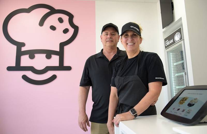 Jennifer Krumm, with some help from her husband, John, is opening a Crumbl Cookies location in South Elgin. They'll hold their grand opening Friday