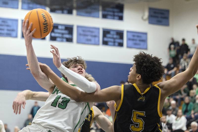 Rock Falls’ Ryken Howard is fouled in OT by Riverdale’s Aris Morgan Friday, Feb. 28, 2025, during the Class 2A Regional final at Bureau Valley High School.