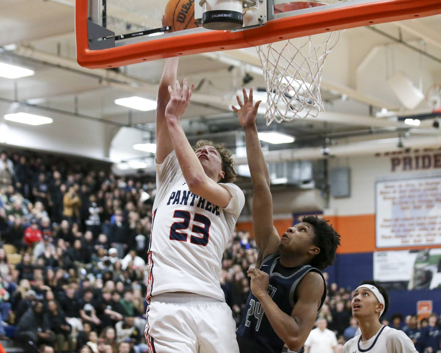 Oswego's Cole Jansons (23) puts in a layup to help seal their win over Oswego East Friday, Jan 9, 2026 in Oswego.