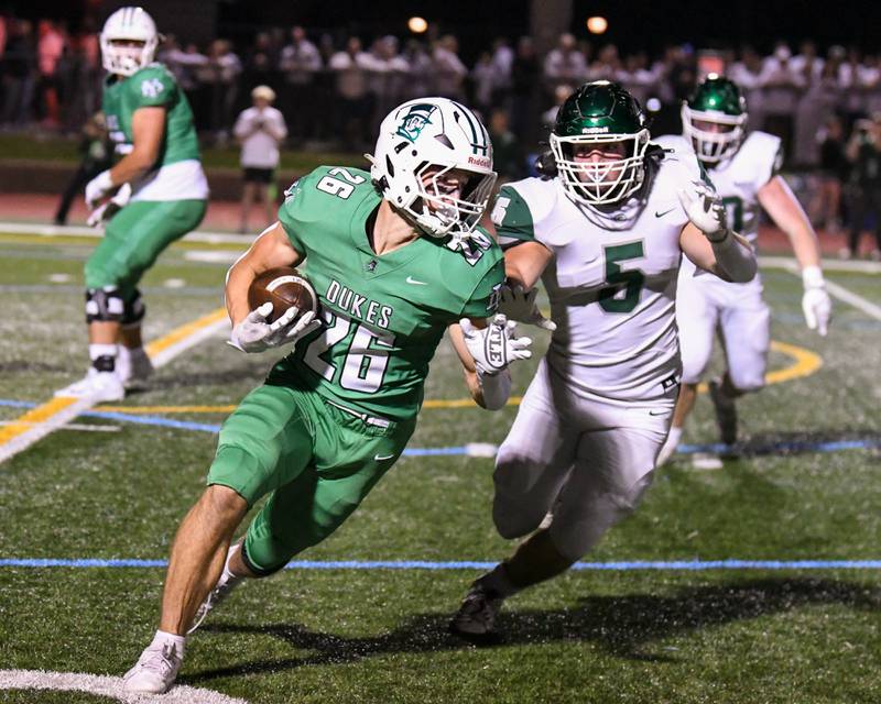 York's Henry Duda (26) runs the ball while being defended by York's Anderson Roth (5) during the game on Friday Oct. 17, 2025, held at York High School.