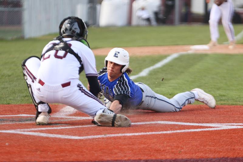 Lincoln-Way East’s Alex Stanwich is tag out trying to steal home against Lockport. Tuesday, April 19, 2022, in Lockport.