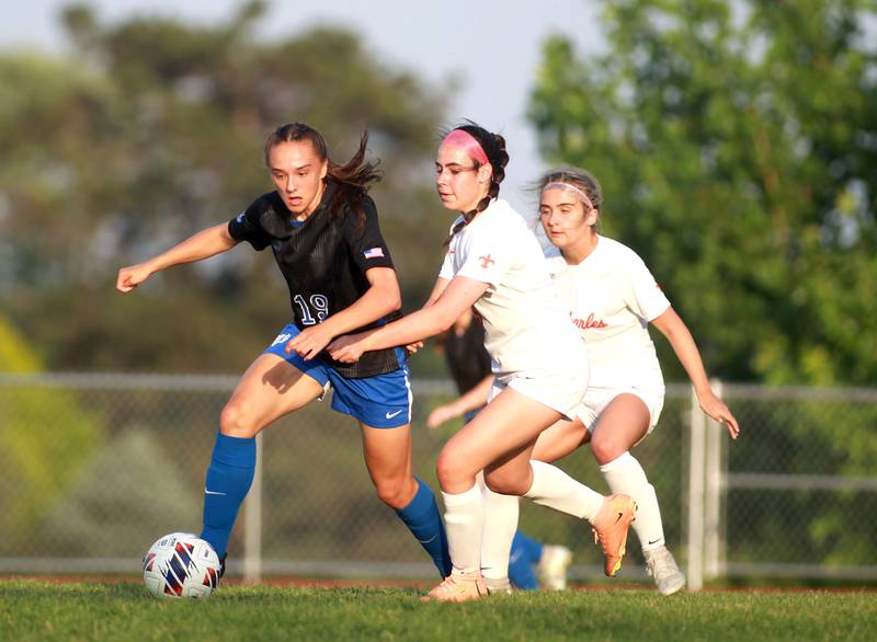 St. Charles North’s Laney Stark (left) and St. Charles East’s Brooklyn Grossi go after the ball during a Class 3A South Elgin Sectional semifinal game on Tuesday, May 21, 2024.
