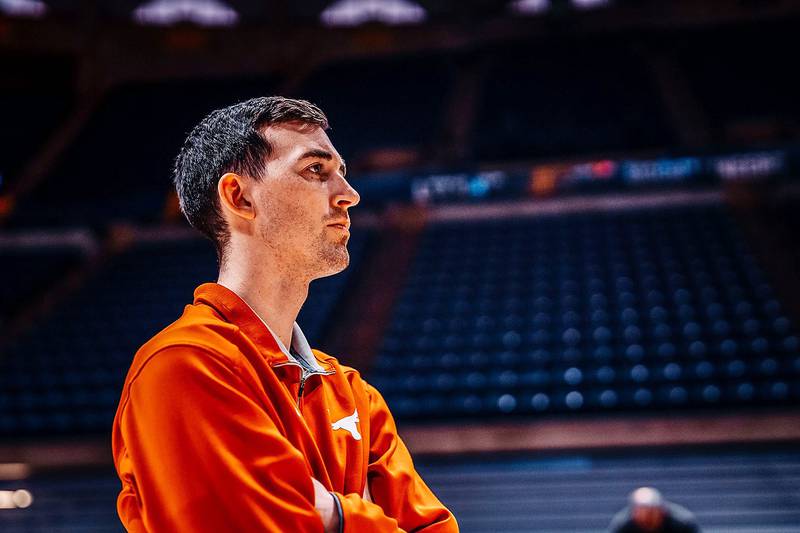 Rock Falls native KJ Conklin watches practice last season while serving on the University of Texas basketball staff.