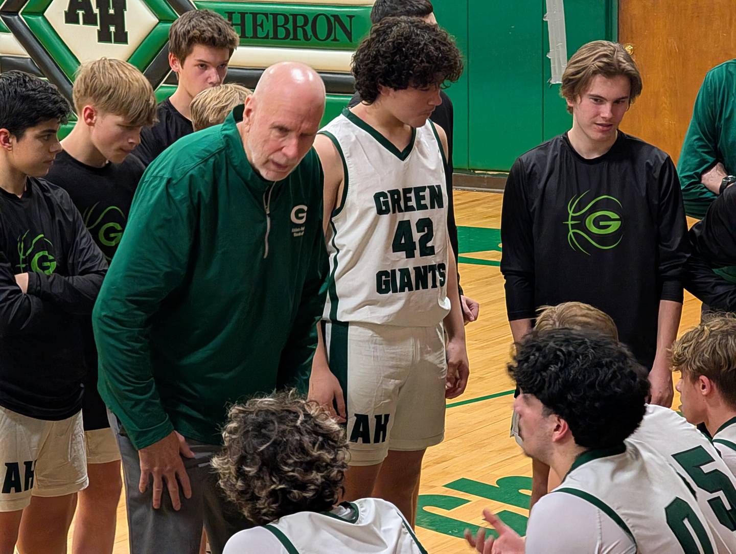 Alden-Hebron boys basketball coach Rick Peterson talks to his team before the second half of its game against Our Lady of the Sacred Heart Academy on Thursday, Feb. 5, 2026, in Hebron.