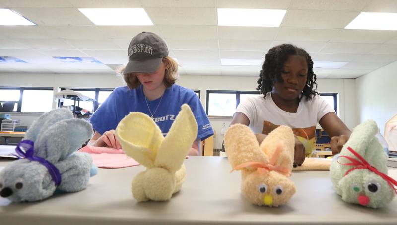 Trisha Kloepping and Myricle Johnson make baby boo bunnies out of towels in the early childhood education class during the Area Career Center Hands-On Showcase on Thursday, June 8, 2023 at La Salle-Peru Township High School.