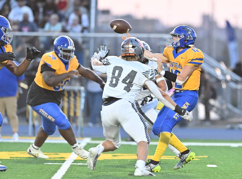 Joliet Central's Paul Slick throws the ball under pressure during a non-conference game against Minooka on Friday, Sep 13, 2024 at Joliet. (Dean Reid for Shaw Local News Network)
