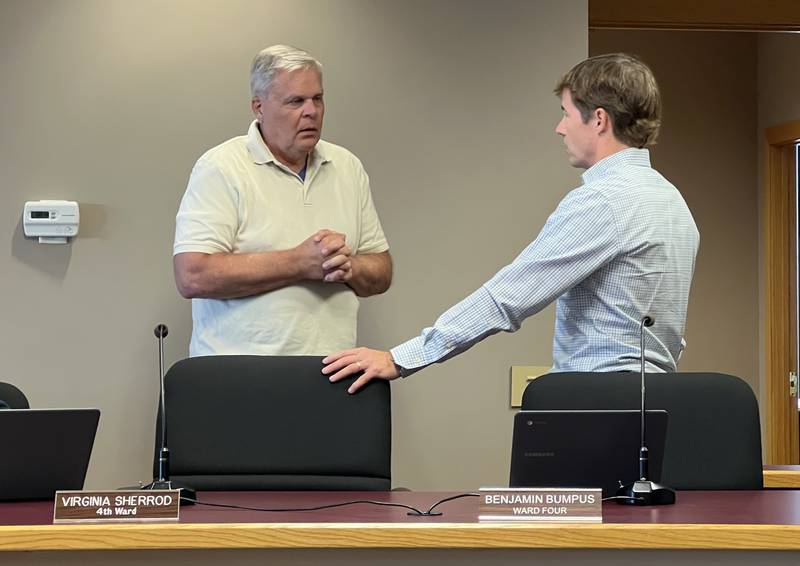 Sycamore Mayor Steve Braser and 3rd Ward Alderperson Ben Bumpus talk before the start of the July 17, 2023 Sycamore City Council meeting.