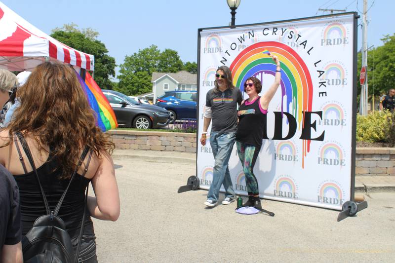 Attendees of the Downtown Crystal Lake Pride & Social line up to take pictures on June 1, 2025.