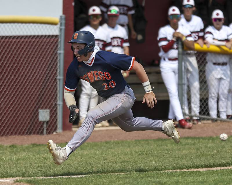 Oswego's Dylan King (20) races the ball to the plate during Class 4A Plainfield North Regional final baseball game between Oswego at Plainfield North. Saturday, May 31, 2025 in Plainfield.