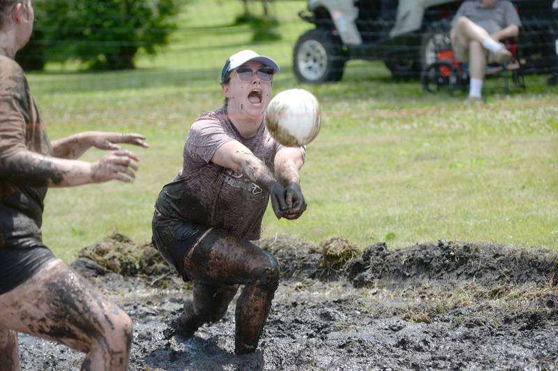 Celina VanHienes of Camanche, Iowa, digs a ball during a mud volleyball game at Hooppole Fun Day on Saturday, June 28, 2025 in Hooppole.