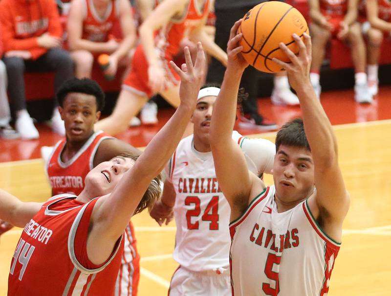 L-P's Erick Sotelo grabs a rebound over Streator's Nolan Lukach during the Dean Riley Shootin' The Rock Thanksgiving Tournament on Monday, Nov. 25, 2024 in Kingman Gym at Ottawa High School.