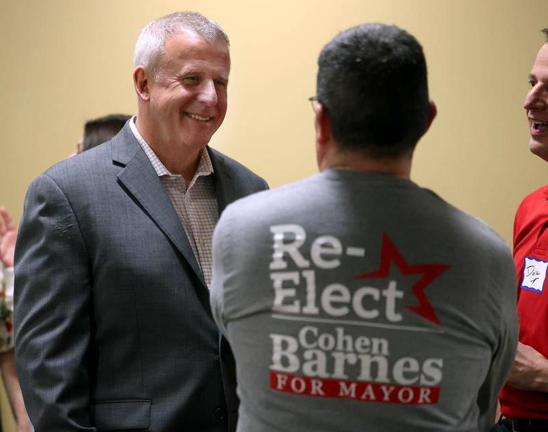 DeKalb Mayor Cohen Barnes, who is running for reelection, talks to a supporter Tuesday, April 1, 2025, during an election night watch party at Faranda's Banquets in DeKalb.