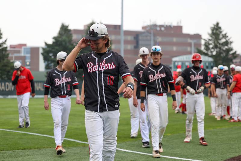 Bradley-Bourbonnais senior Ty Alderson leaves the field with his teammates following the Boilermakers’ 2-0 loss to Normal Community in the IHSA Class 4A Illinois Wesleyan University Sectional semifinal on Thursday, June 5, 2025.