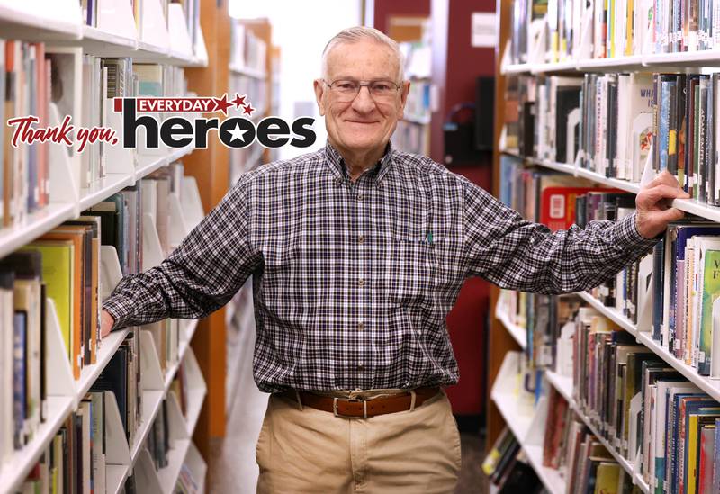 Longtime DeKalb Public Library volunteer Paul Mandigo, 83, Wednesday, March 25, 2026, among the rows of books he organizes at the library in DeKalb.