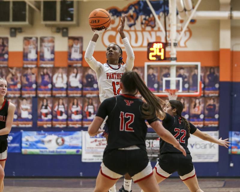 Oswego's Destiny Hicks (12) shoots a jumper during their basketball game between Yorkville at Oswego, Feb 7, 2026 in Oswego.