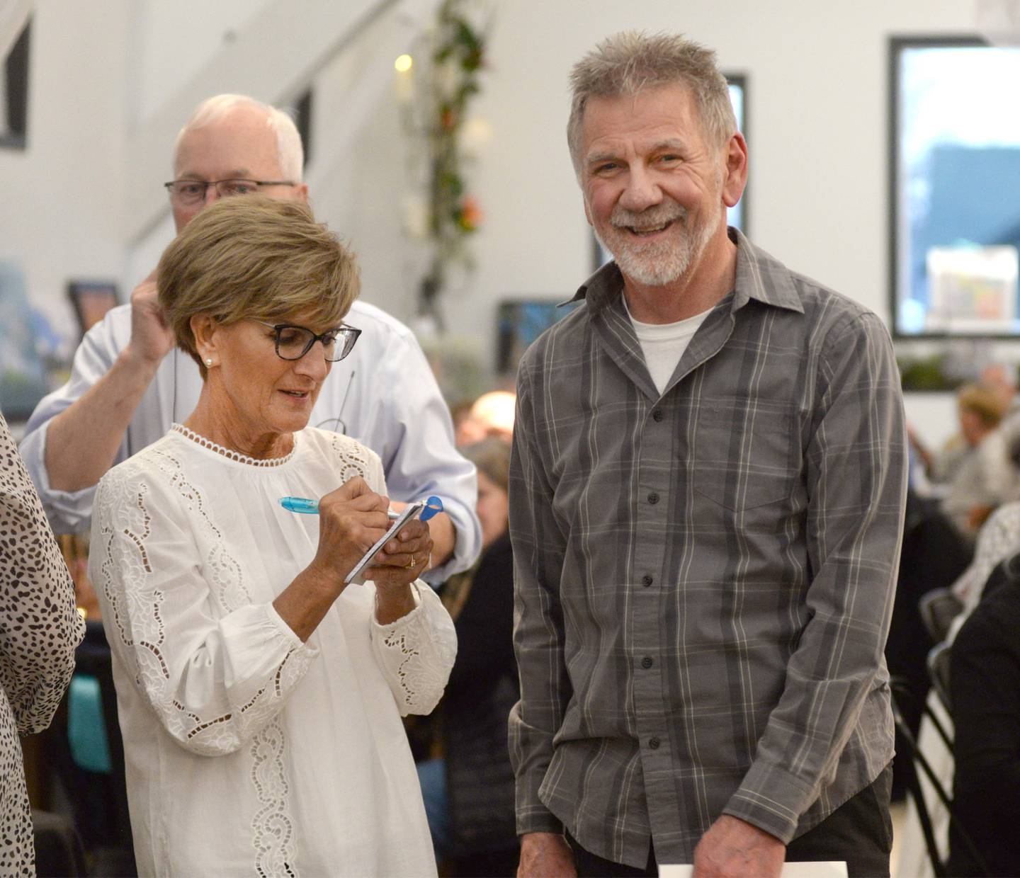 Merlin Hageman smiles as he waits to dash to pick art during the Serenity Hospice and Home’s Fourth Annual Art Dash fundraiser on Wednesday, April 9, 2025, at River’s Edge Experience, 103 S. First St., Oregon.