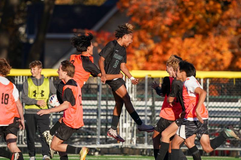 Glenbard West's Catino Harris (3) who earlier scored the game winning goal celebrates with his team after defeating St. Charles North to win the class 3A Glenbard West Regional soccer final at Glenbard West High School in Glen Ellyn on Saturday, Oct. 26, 2024.
