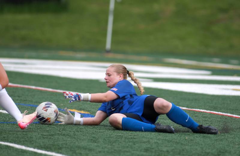 St. Charles North's Lauren Korioth makes a save during a Class 3A Glenbard West Sectional semifinal game against St. Charles East on Tuesday, May 27, 2025 in Glen Ellyn.