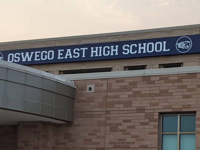 Oswego School District 308 is investigating acts of vandalism that occurred at Oswego East High School Wednesday night, including racial slurs written on the school grounds.