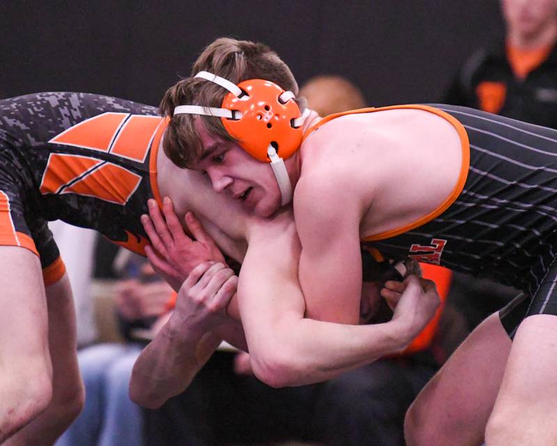 Ben Butler, right, of Crystal Lake Central tries to keep a hold of the Washington wrestler Tuesday Feb. 21st in the 160 weight class during the wrestling dual sectional held at Sycamore High School.