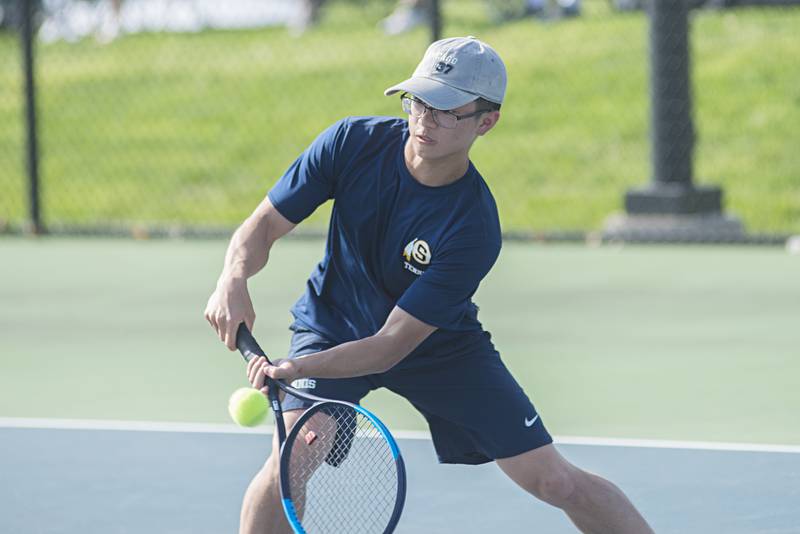 Sterling’s Connor Pham returns a shot against Newman Monday, May 9, 2022. Valentino and doubles partner Luke Valentino faced off against the Comets’ Tyler Bonnell and Koda Brininger.